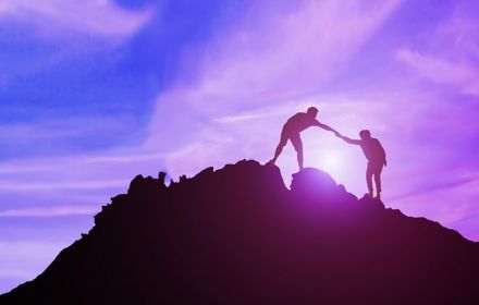 two men climbing mountain