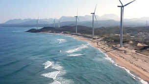 windmills on the shore