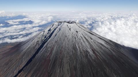 Top of Mt Fuji is covered by snow in this photo