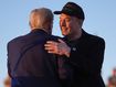 Republican presidential nominee former President Donald Trump hugs Elon Musk at a campaign rally at the Butler Farm Show, Saturday, Oct. 5, 2024, in Butler, Pa. 