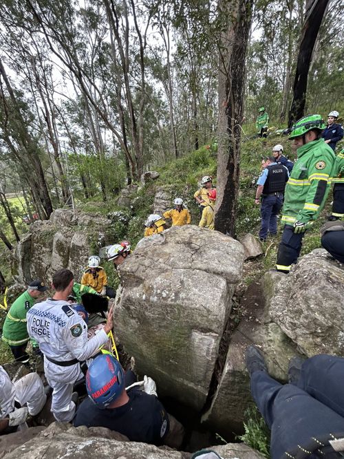 Woman stuck between two boulders in NSW