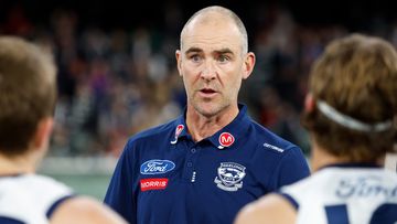 Geelong assistant coach Steven King addresses the players during a match against Melbourne Demons.