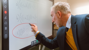 Teacher using the whiteboard