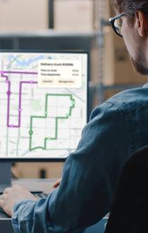 A person using the Route Optimization API on a computer