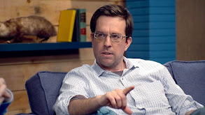 Ed Helms Wears a Grey Shirt & Brown Boots thumbnail