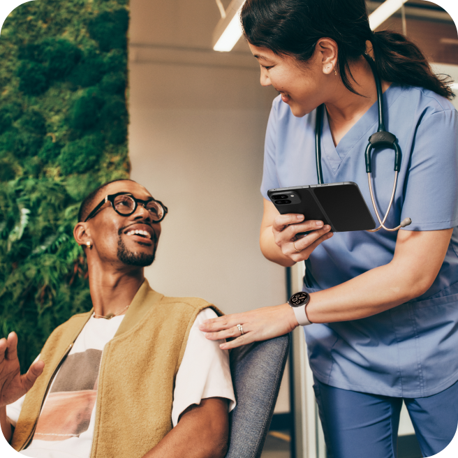 A doctor showing a patient information on her Pixel 9 Pro Fold.