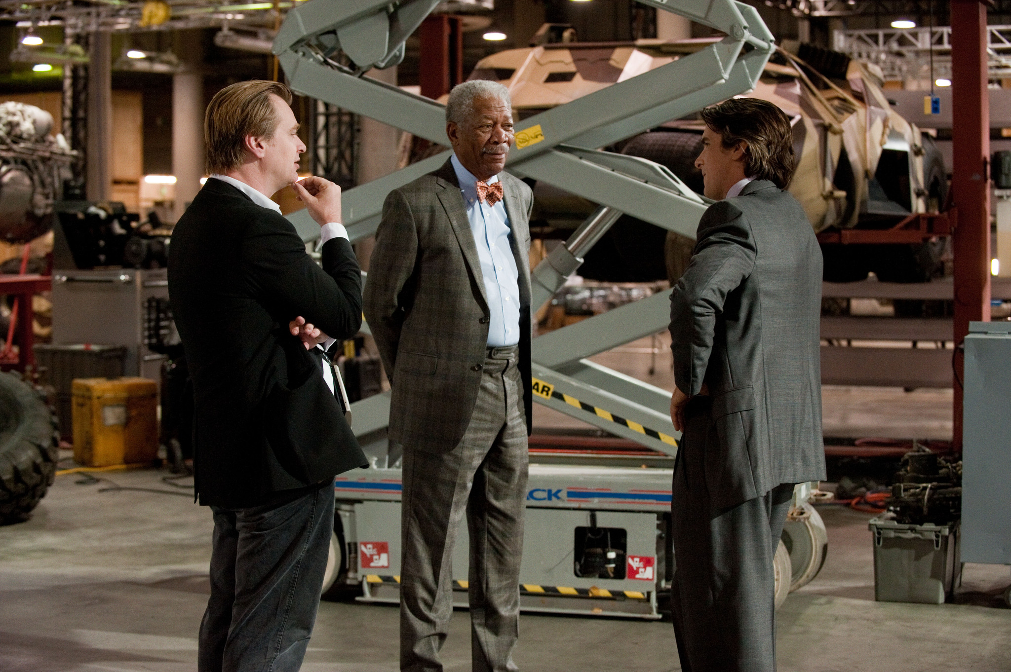 Morgan Freeman, Christian Bale, and Christopher Nolan in The Dark Knight Rises (2012)