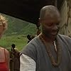 Charlize Theron and Robert Wisdom in Mighty Joe Young (1998)