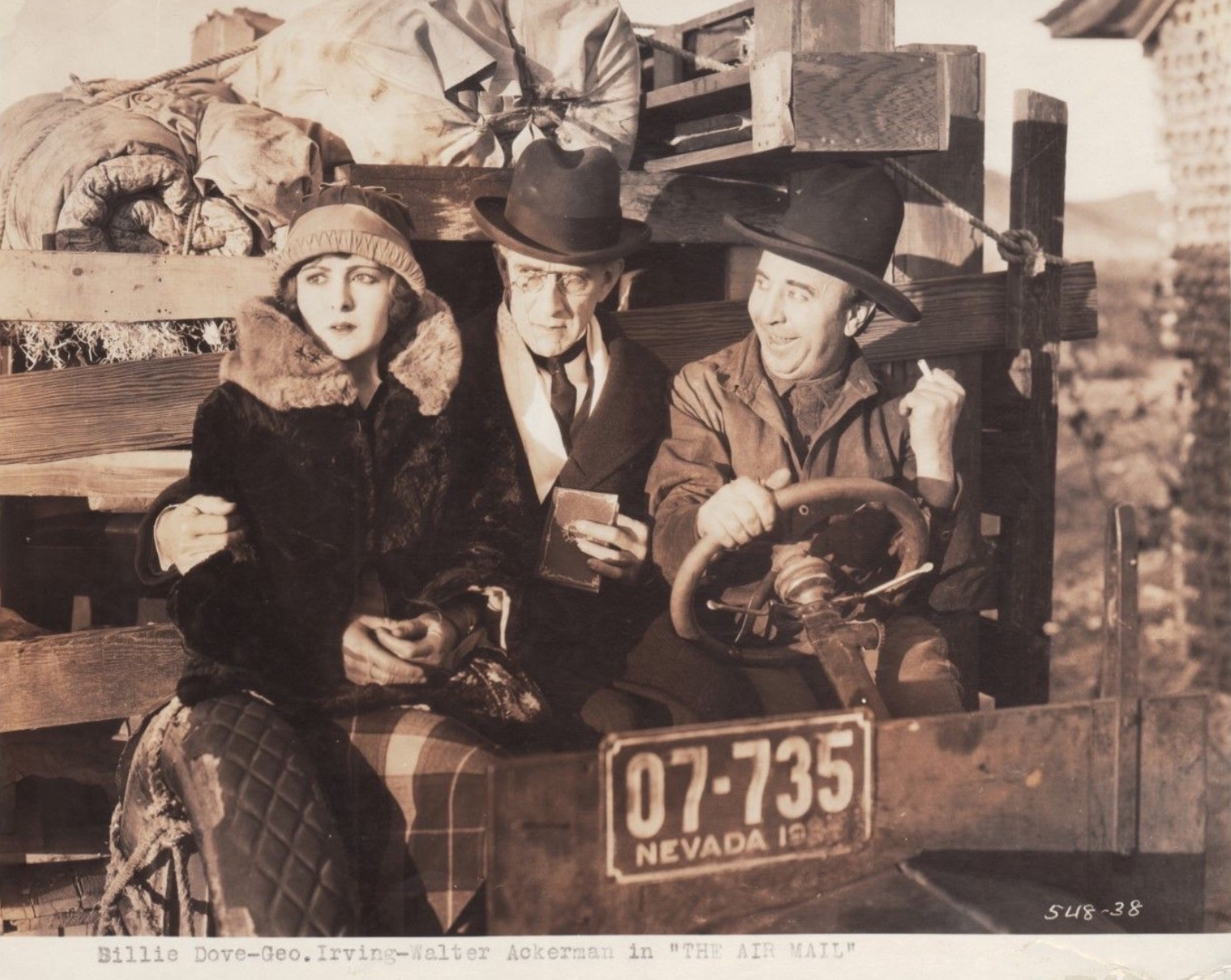 Walter Ackerman, Billie Dove, and George Irving in The Air Mail (1925)