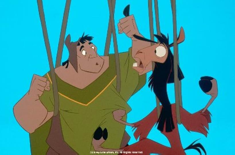 Pacha and Kuzco dangle above a gorge