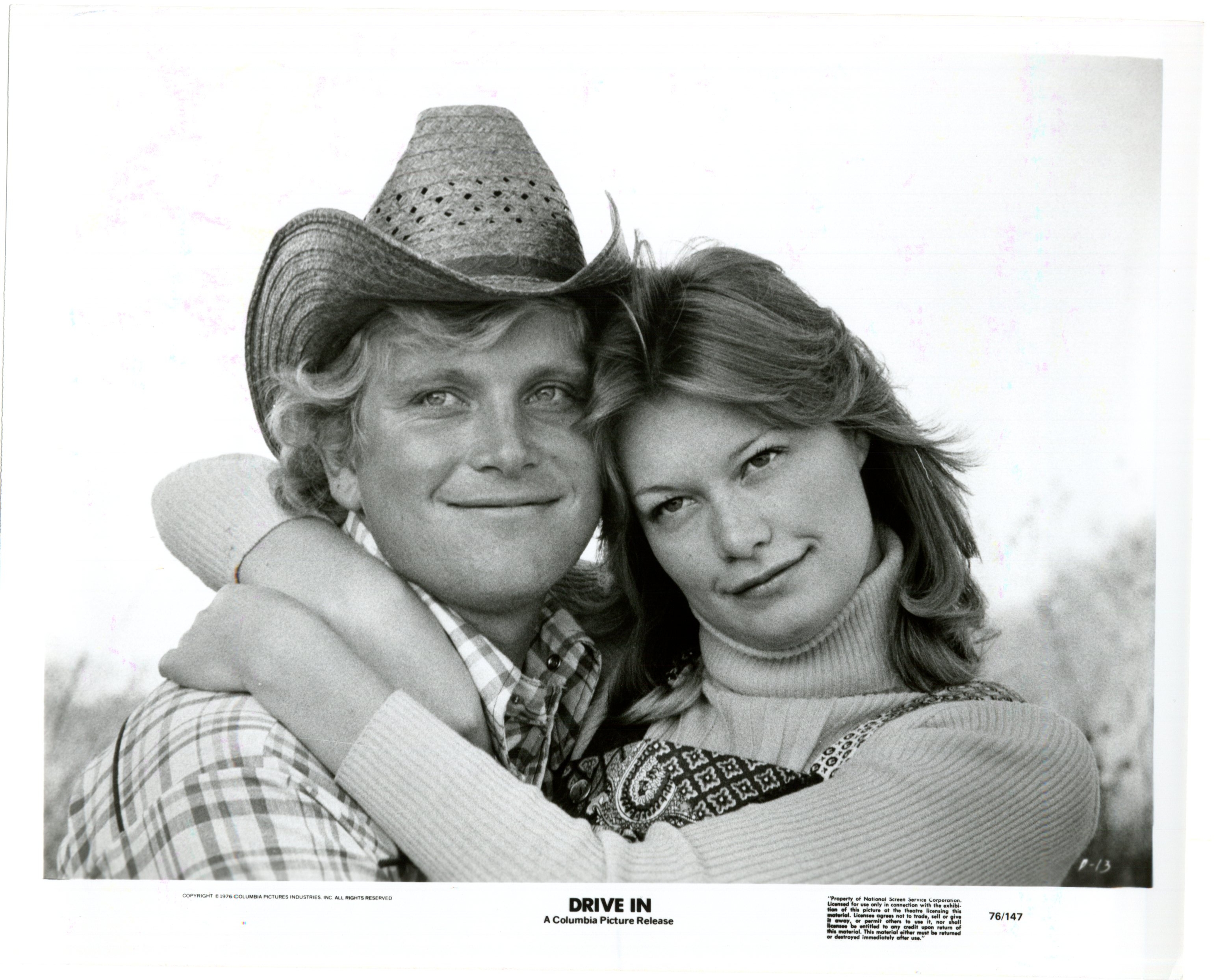 Ashley Cox and Kent Perkins in Drive-In (1976)