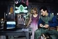 John Leguizamo plays Super Mario World as Samantha Mathis watches.