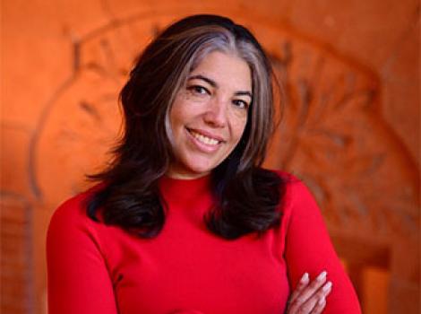 African American woman with long black hair in a red sweater