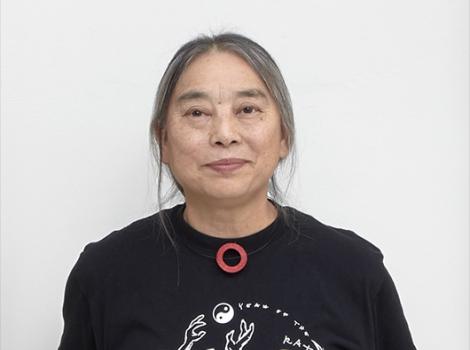 Detail photo of an Asian woman in a black shirt