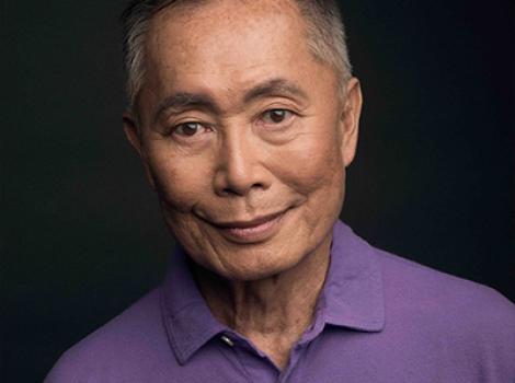 bust length photo of an Asian man in a purple shirt