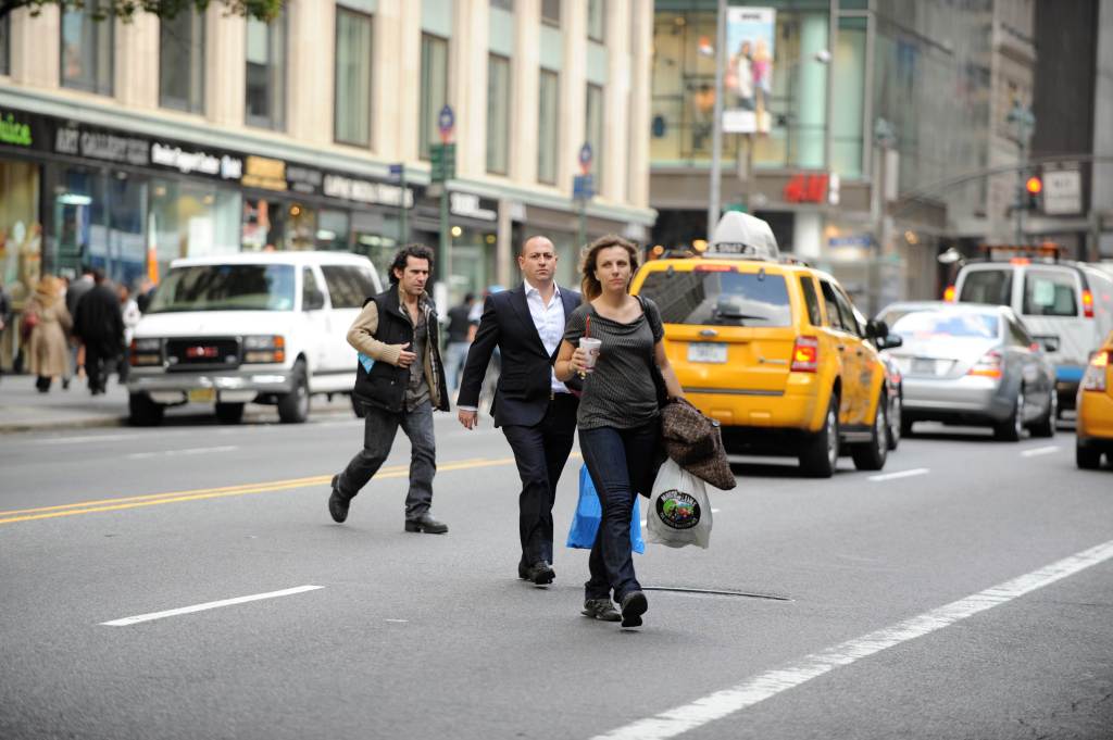 Pedestrians jaywalk across a NYC street on Oct. 13, 2009.