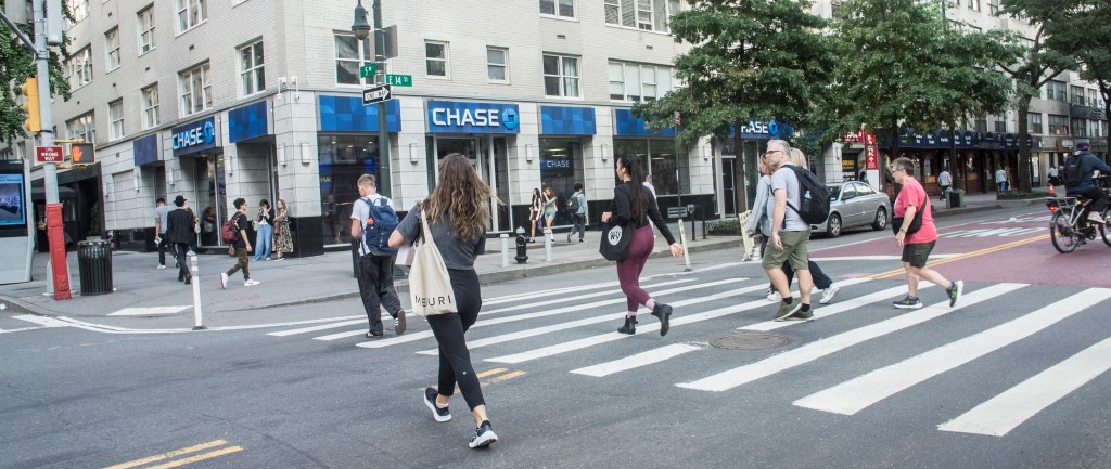 New Yorkers cross the intersection at 5th Avenue and 14th Street in Manhattan on Sept. 30, 2024.