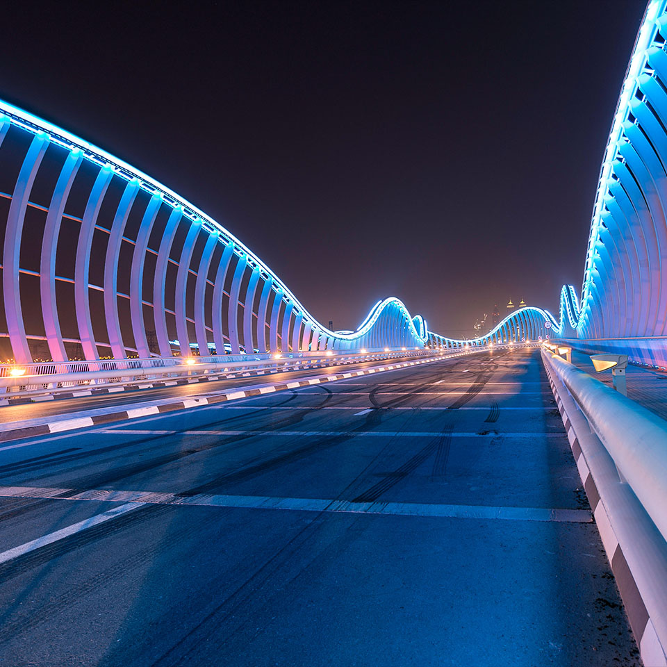 Meydan Bridge at night in Dubai.