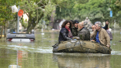 People are rescued in Faenza, Italy, on Thursday, May 18, 2023. Exceptional rains, in a drought-struck region of northern Italy on Wednesday swelled rivers over their banks, killing at least nine people, forcing the evacuation of thousands and prompting officials to warn that Italy needs a national plan to combat climate change-induced flooding.