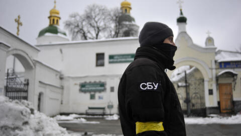 A file photo showing a Ukraine Security Service (SBU) serviceman standing in front of the entrance of Kyiv Pechersk Lavra monastery in Kyiv on November 22, 2022.