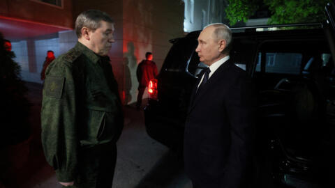 A file photo showing Russian President Vladimir Putin meeting with Chief of the General Staff of Russian Armed Forces Valery Gerasimov in the headquarters of the troops involved in the country's milit