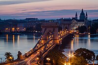 Chain Bridge, with a view of Gresham Palace and St. Stephen's Basilica, Budapest Author: Follett