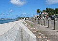 The new seawall at Charlestown, Nevis, in 2005. Saint Kitts is seen in the background across the channel known as The Narrows; the museum of Nevis history is visible in the mid distance