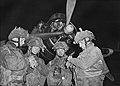 Pathfinders synchronising their watches in front of an Armstrong Whitworth Albemarle