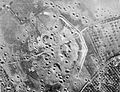 Overhead aerial of the gun battery at Merville (3km east of Ouistreham) consisting of four medium casemates, after air bombardment, c May 1944. Bombing failed to penetrate the casemates and, because of the threat the battery posed to the landings on SWORD Area, it was attacked and neutralised by 9th Bn the Parachute Regiment in the early hours of 6 June.