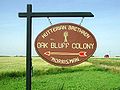 Road sign pointing to an hutterian colony