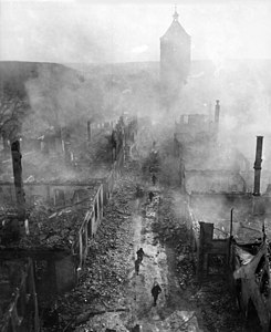 1945 Infantrymen move down a street in Waldenburg