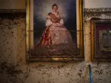 A painting hangs near the water level marker in an area affected by floods in Paiporta, Valencia, Spain, Tuesday, Nov. 5, 2024. (AP Photo/Emilio Morenatti)