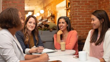 group of women connecting, talking and smiling