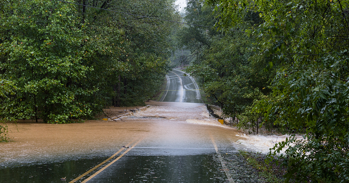 Unpassable road flooded by river