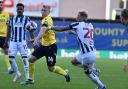 Louie Sibley battles for the ball against West Brom