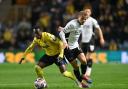 Siriki Dembele weaves forward against Derby County