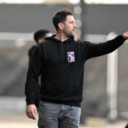 Oxford United head coach Des Buckingham on the touchline against Burnley