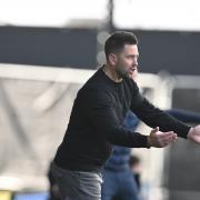 Oxford United head coach Des Buckingham on the touchline