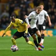 Siriki Dembele weaves forward against Derby County