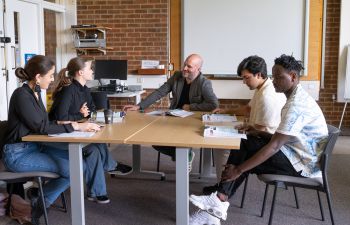 Dan Sumner and four students from the English For Refugees course